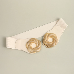 Detail of cream elastic waist belt with textured gold interlaced circular buckle
