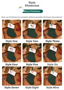 Detail of green knit Christmas stockings with embroidered red letters and holly decor