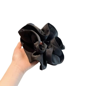 Classic black oversized fabric scrunchie for elegant bun hairstyles and ponytail styling