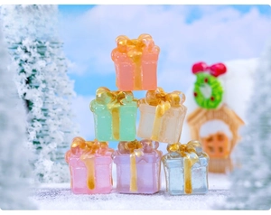 Close-up of colorful resin Christmas gift box miniatures for DIY micro landscapes