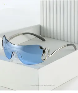 Detail view of blue gradient oversized sunglasses with silver metal snake decoration