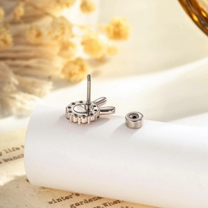 Sweet rabbit stud earring with pink gemstones and screw back design in silver metal finish