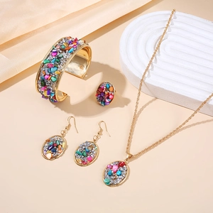 Bohemian gold jewelry set with colorful crushed stones including necklace and bracelet