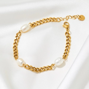 Gold-plated stainless steel Cuban link bracelet with three elegant white baroque pearls