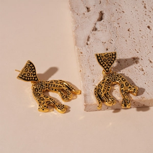 Vintage golden leopard triangle earrings for women with retro textured metal finish
