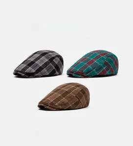 Detailed close-up showing texture of plaid newsboy caps in three retro color patterns