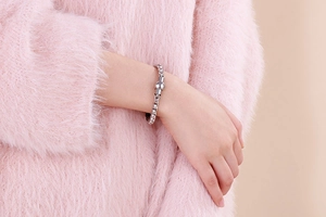 Silver bead chain bracelet on wrist with elegant magnetic clasp and minimalist steel links