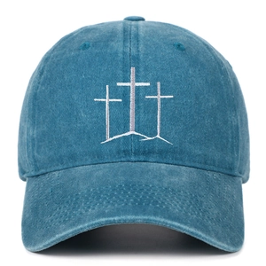 Detailed embroidery of three white crosses on vintage washed denim baseball cap