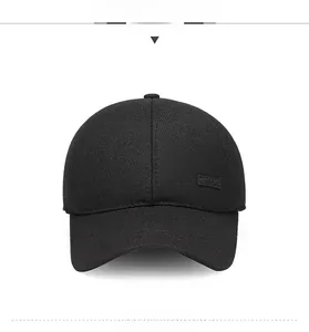 Detailed front view of black cotton baseball cap with textured Sport patch and air vents