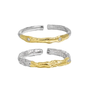 Two-tone silver and gold plated textured rings with zircon stones in a set