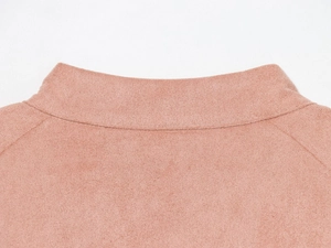 Close-up of pink suede jacket featuring a high collar and fine stitching details