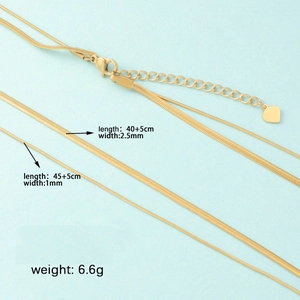 Double-layered gold snake chain necklace with flat blade links and lobster clasp
