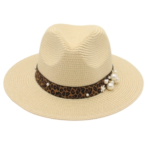 Detailed view of beige straw fedora featuring leopard print band and pearl embellishments