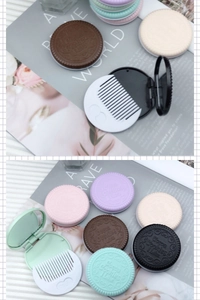Detail of creative chocolate cookie shaped pocket mirror and small white comb set
