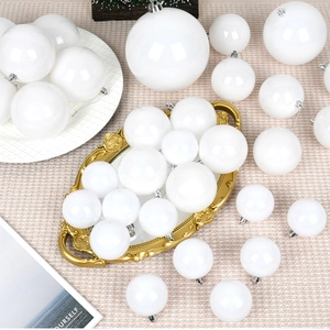 Assorted white plastic Christmas ball ornaments in various sizes for tree decoration