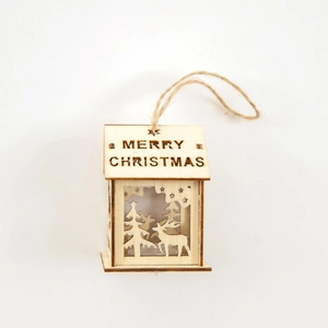 Wooden Christmas house ornament with laser-cut deer scene and Merry Christmas text