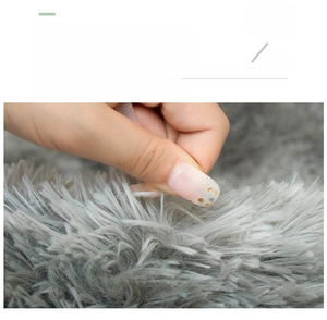 Macro detail of plush grey shaggy rug showing non-shedding fibers and tight weaving