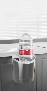 Wall-mounted transparent trash bin showing strong load-bearing capacity with a 5L bottle