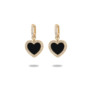 Macro detail of French vintage heart-shaped gold earrings with black inlay and diamonds