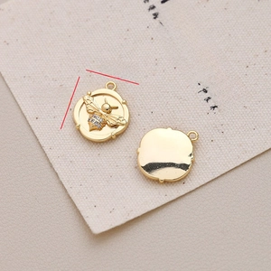Detailed view of gold-plated bee relief charms with zircon inlay showing dimensions