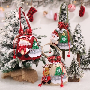 Three Christmas burlap drawstring gift bags with Santa, snowman and reindeer 3D dolls