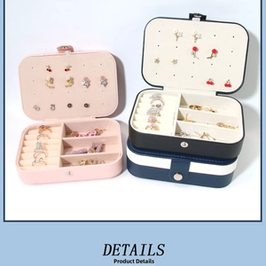 Macro shot of jewelry box interior with earring studs holder and velvet ring slots