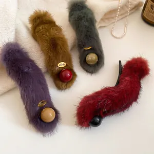 Chic winter plush hair clips in purple, brown, green and red with Lucky gold tag