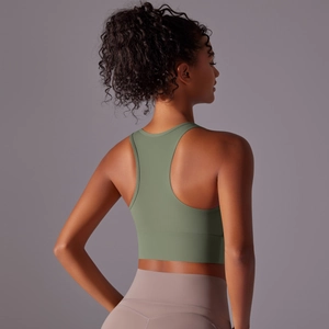 Women's racerback sports bra in sage green with wide hem for yoga and fitness support