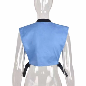 Detail view of sky blue cropped vest with black piping and adjustable back straps