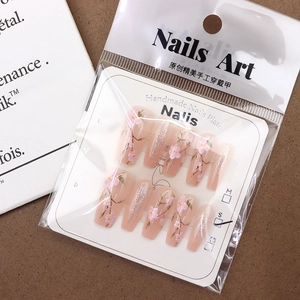 Pink sakura floral press-on nails set with glitter in a medium trapezoid shape