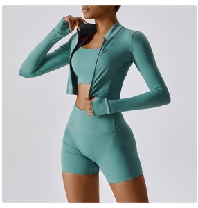 Three-piece turquoise yoga set featuring slim-fit zip jacket, sports bra, and high-waist shorts
