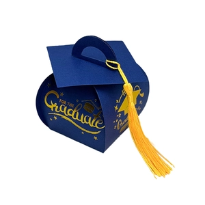 Close-up of blue doctoral hat graduation gift box with gold lettering and yellow tassel