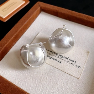 Brushed silver finish bud-shaped earrings with matte metallic spherical interior design