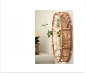Detail of round tiered bamboo wall shelf with natural textures and wooden shelves