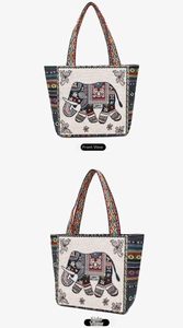 Detailed front and side view of ethnic canvas tote bag with embroidered elephant pattern