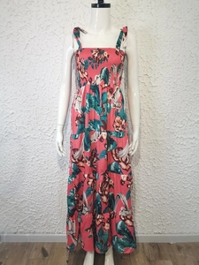 Detail of bohemian floral print dress featuring a smocked bodice and tiered maxi skirt layers
