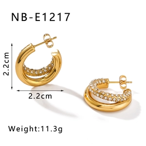 Detail view of 18K gold plated C-shape twist earrings with crystals and size parameters