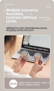Detail showing grey portable neck fan used in an office setting with a laptop