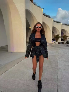 Three-piece black leisure set featuring logo print jacket, crop top and high waist shorts