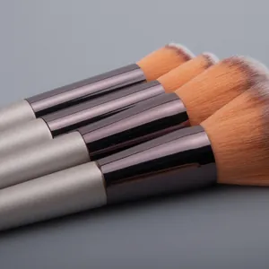 Champagne gold makeup brush set with purple aluminum tubes and soft gradient bristles