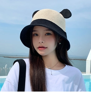 Close-up of contrast knit bucket hat with cute panda ears and large brim design