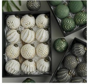 Detailed macro view of 8cm vintage Christmas balls with embossed leaf and geometric textures