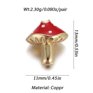 Macro view of tiny red mushroom charm with gold copper stem and white dots for DIY jewelry