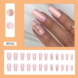 Detailed view of matte pink press-on nails set W502 with 3D metal Love letter accents