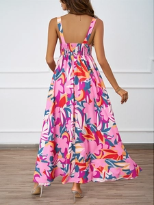 Detail of floral summer maxi dress with smocked elastic back and flowy pink pattern
