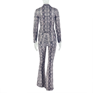 Back view of slim snake print set featuring long sleeve top and flared trousers