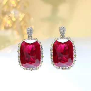 Luxury pigeon blood red ruby earrings with rectangular gemstone and halo diamonds