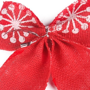 Red linen Christmas bow with white snowflake pattern for holiday tree decoration