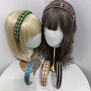 Detailed view of luxurious baroque headbands with vibrant rhinestones in five colors