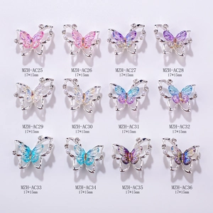 Detailed grid of aurora butterfly nail charms in 12 colors with crystals and pearls